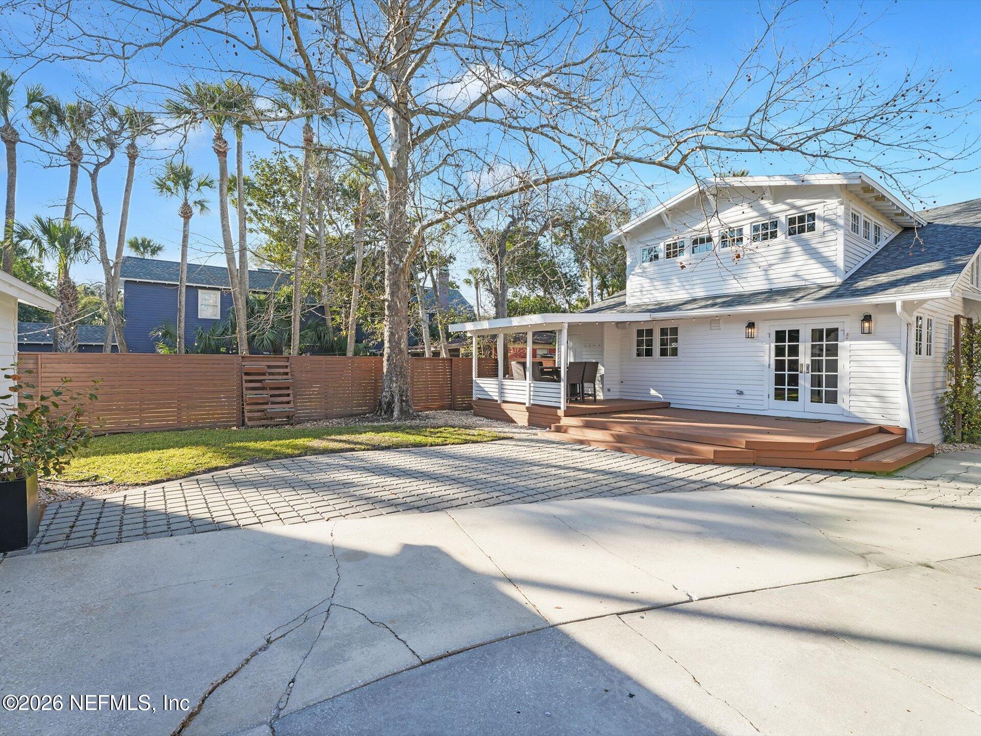 322 6th Street Atlantic Beach, FL 32233 - Photo 38 of 45 a view of pool with brick walls plants and large tree