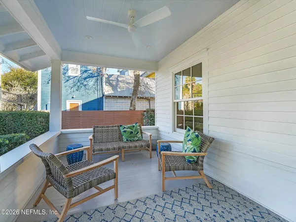 a backyard of a house with outdoor seating