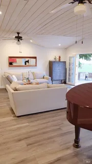 a bedroom with furniture and a chandelier