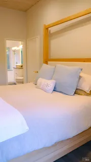 a bed room with furniture and wooden floor