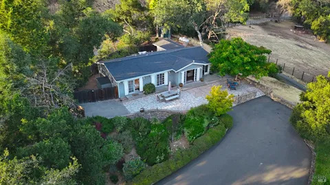 a view of a house with yard and a garden