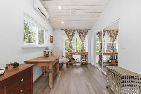 a living room with lots of furniture and a rug
