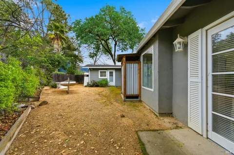 a view of a house with porch and furniture