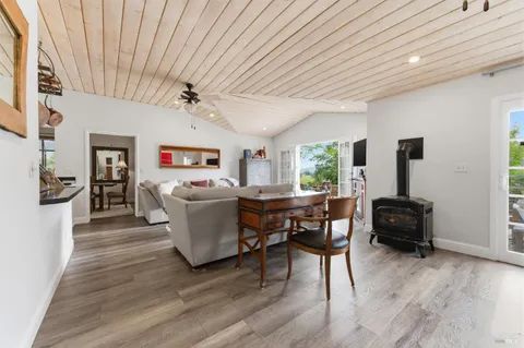 a living room with lots of furniture and a rug