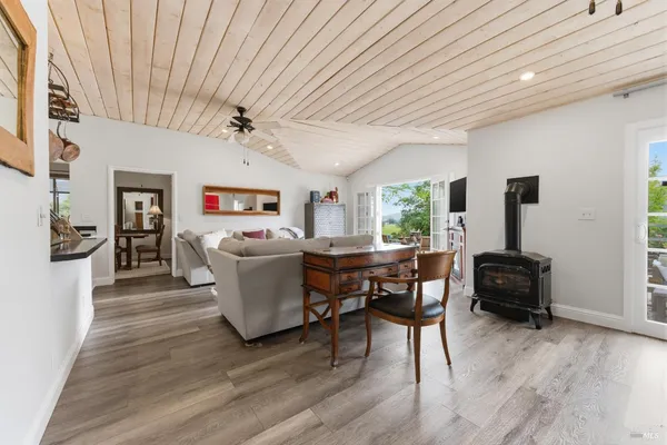 a living room with lots of furniture and a rug