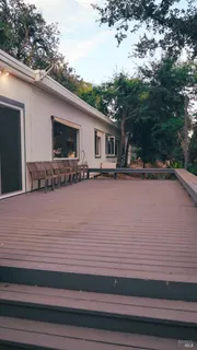 a living room with lots of furniture and a table