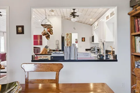 a view of house with backyard and sitting area