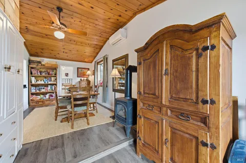 a view of a lush green hillside and houses