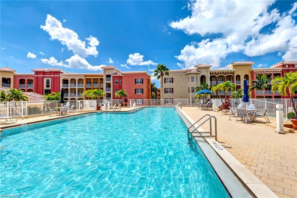 401 Bayfront Place, Unit 3303 Naples, FL 34102 - Photo 17 of 22 a view of a swimming pool with a patio