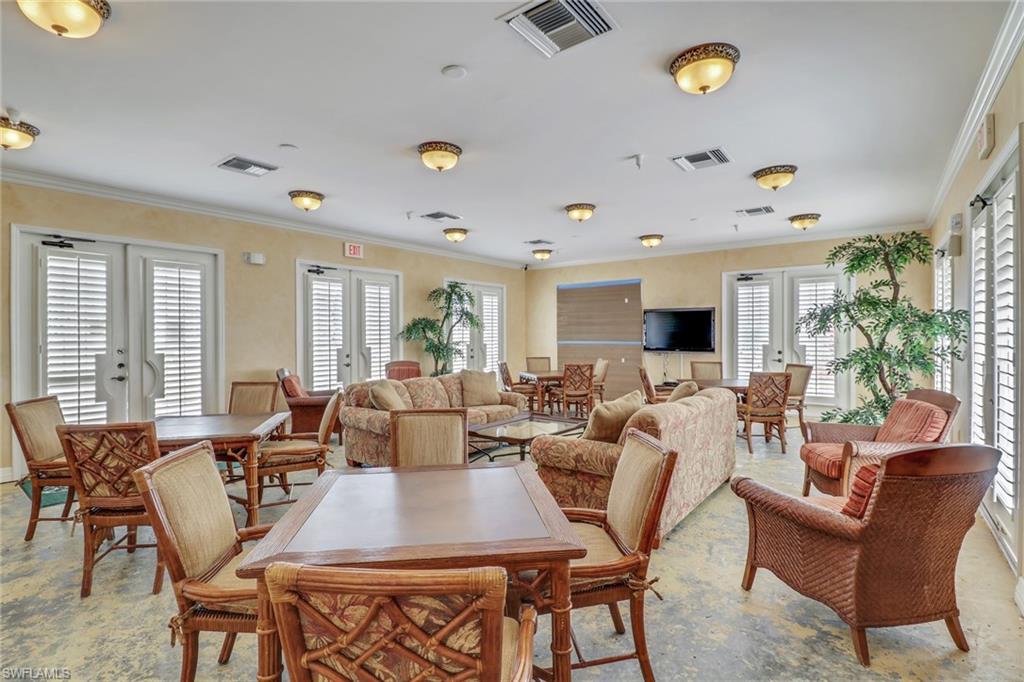 401 Bayfront Place, Unit 3303 Naples, FL 34102 - Photo 20 of 22 a living room with furniture kitchen view and a large window