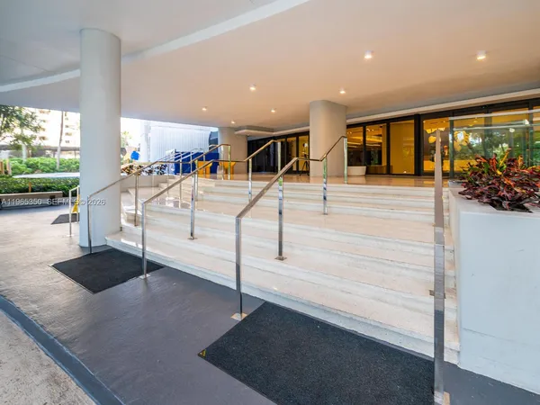 a view of a patio with a table and chairs