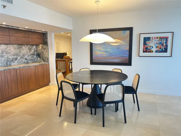 a view of a dining room with furniture window and outside view
