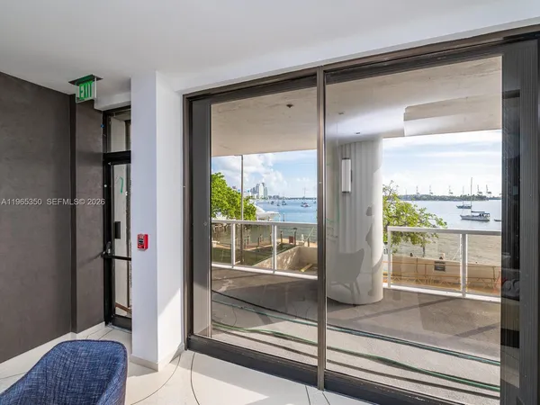 a front view of a building with a garden