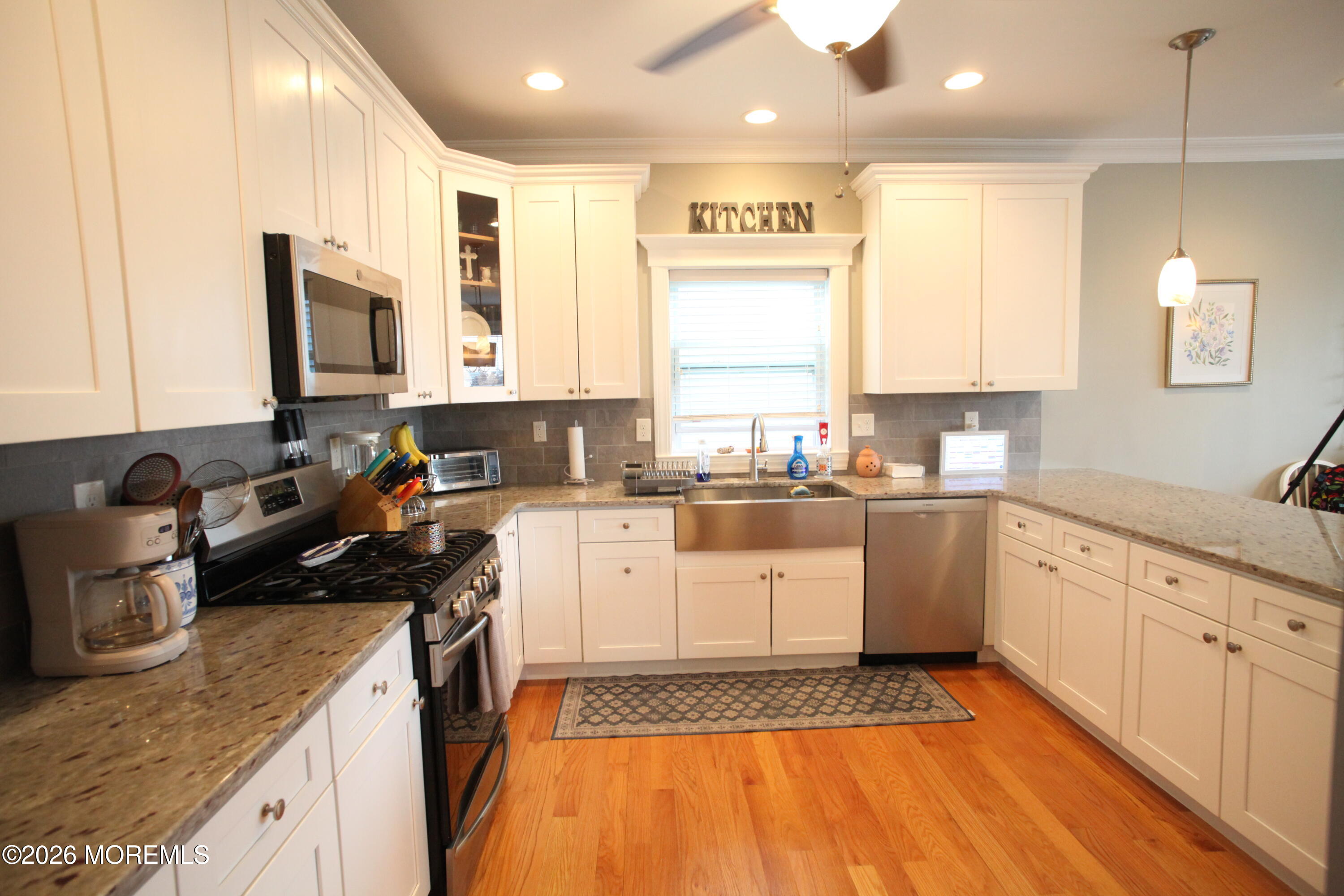 107 Waldron Road Toms River, NJ 08753 - Photo 3 of 20 a kitchen with granite countertop stainless steel appliances a stove sink and cabinets
