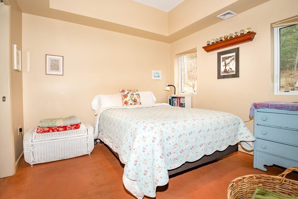 113 Indian Hollow Road Chesterfield, MA 01012 - Photo 14 of 42 a bedroom with a bed and a window