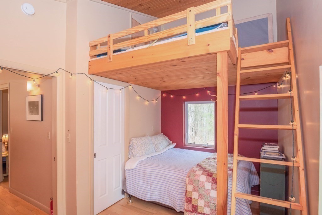 113 Indian Hollow Road Chesterfield, MA 01012 - Photo 23 of 42 a bedroom with a bed and a window