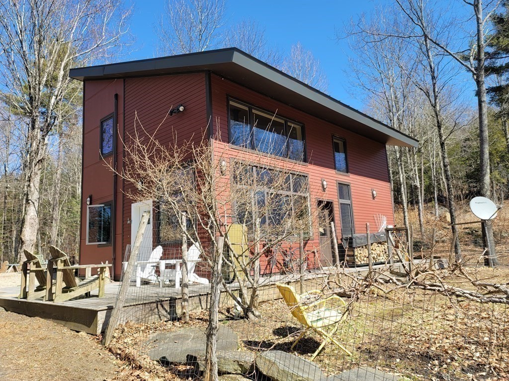 113 Indian Hollow Road Chesterfield, MA 01012 - Photo 30 of 42 a front view of a house with parking