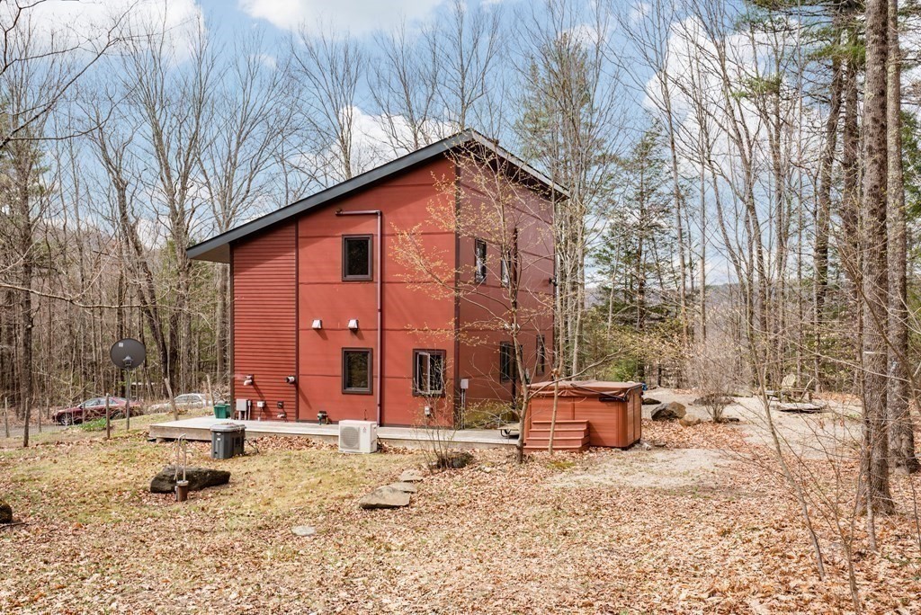 113 Indian Hollow Road Chesterfield, MA 01012 - Photo 32 of 42 a backyard of a house with outdoor seating