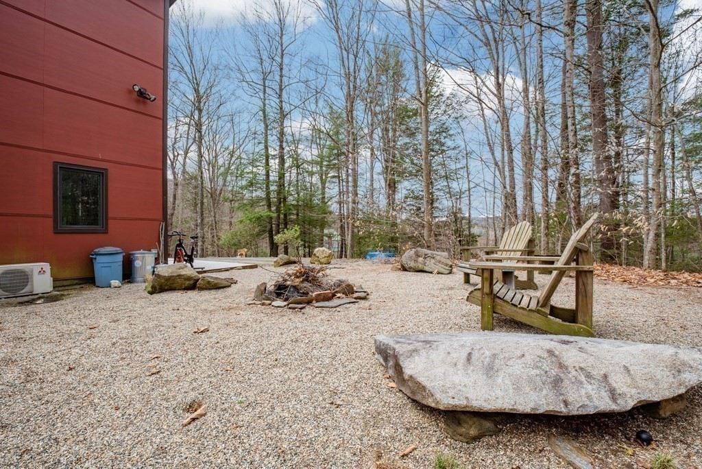 113 Indian Hollow Road Chesterfield, MA 01012 - Photo 34 of 42 a view of a backyard with a table and chairs
