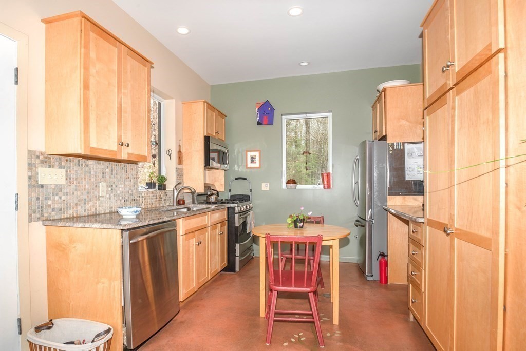 113 Indian Hollow Road Chesterfield, MA 01012 - Photo 4 of 42 a kitchen with a sink and cabinets