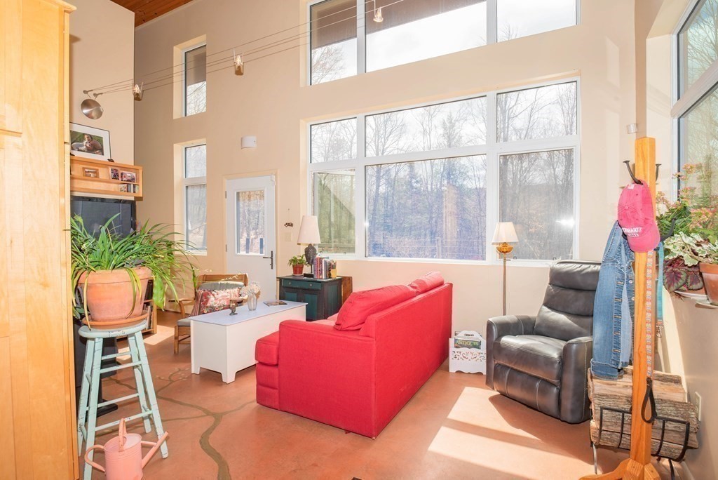 113 Indian Hollow Road Chesterfield, MA 01012 - Photo 9 of 42 a living room with furniture and a large window
