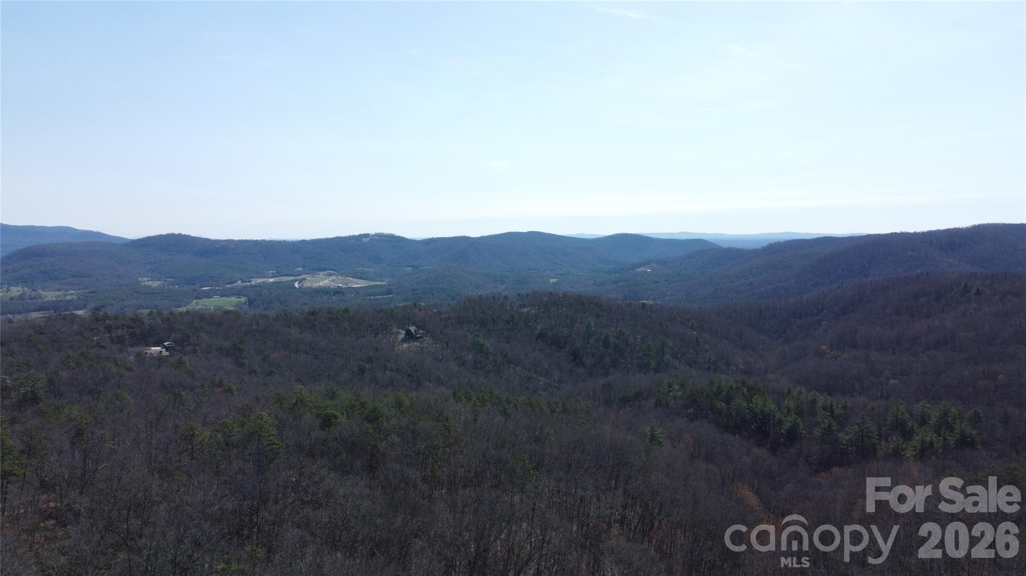 0 Wilderness Road Hays, NC 28635 - Photo 5 of 12 a view of a mountain in the distance in a field