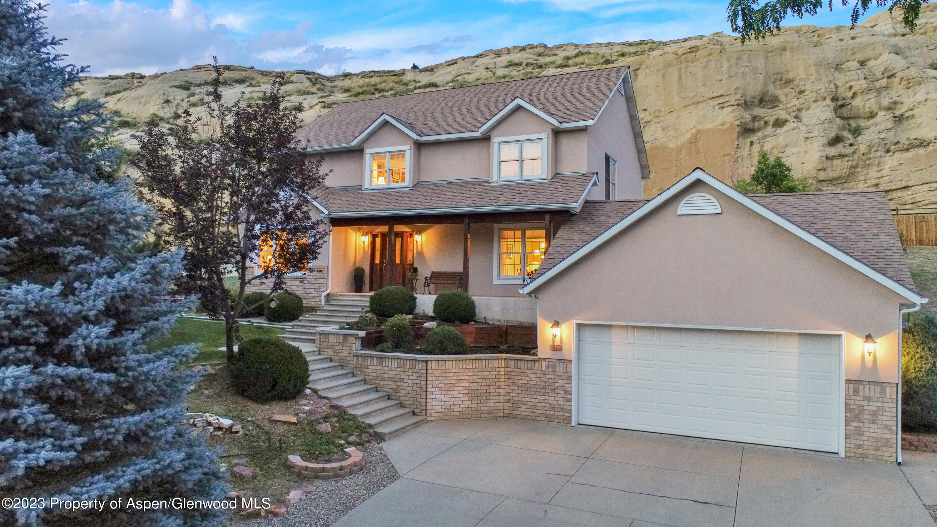 921 Alta Vista Drive Craig, CO 81625 - Photo 1 of 55 a front view of a house with garden