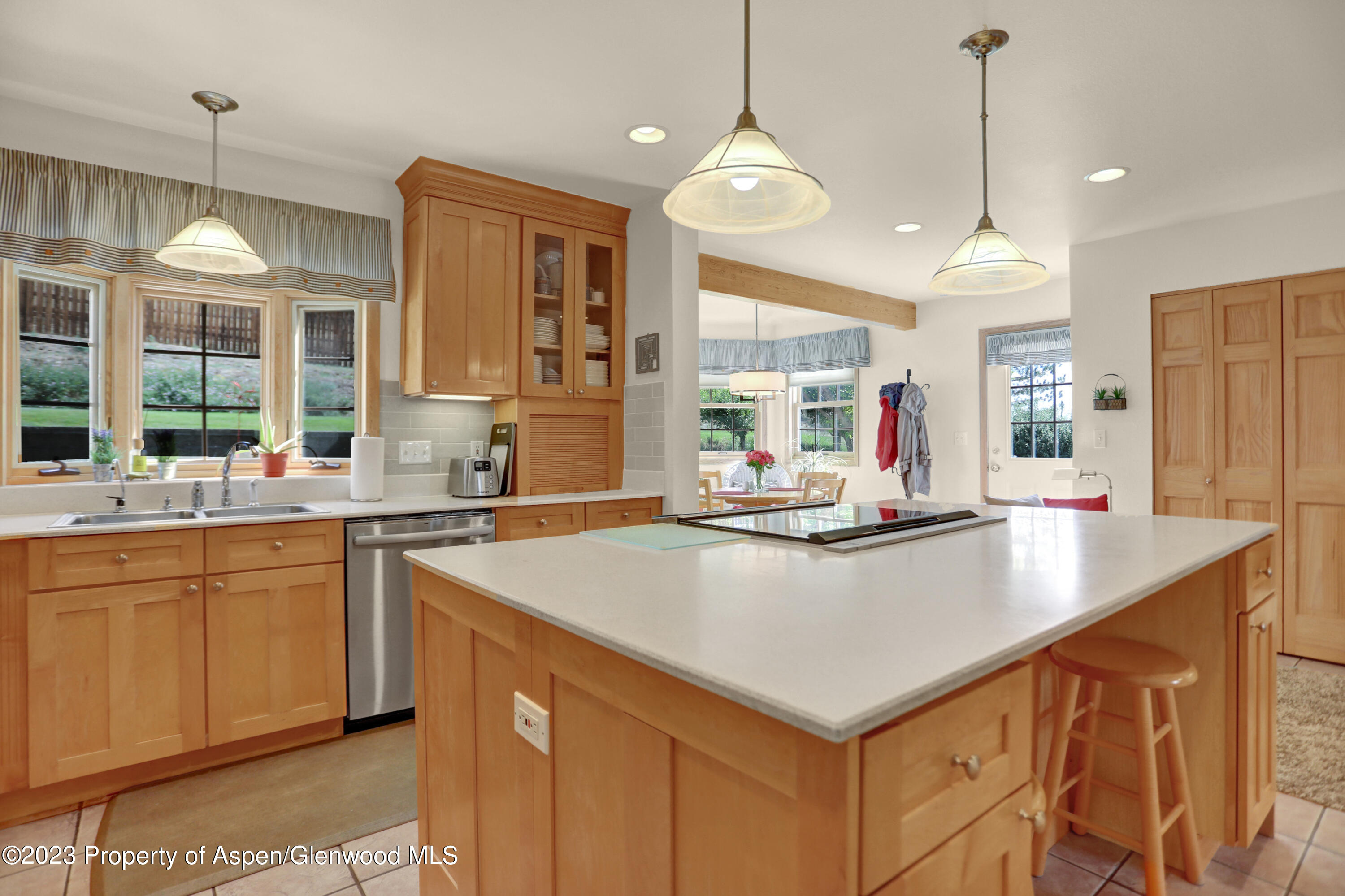 921 Alta Vista Drive Craig, CO 81625 - Photo 12 of 55 a kitchen with stainless steel appliances a sink stove and cabinets