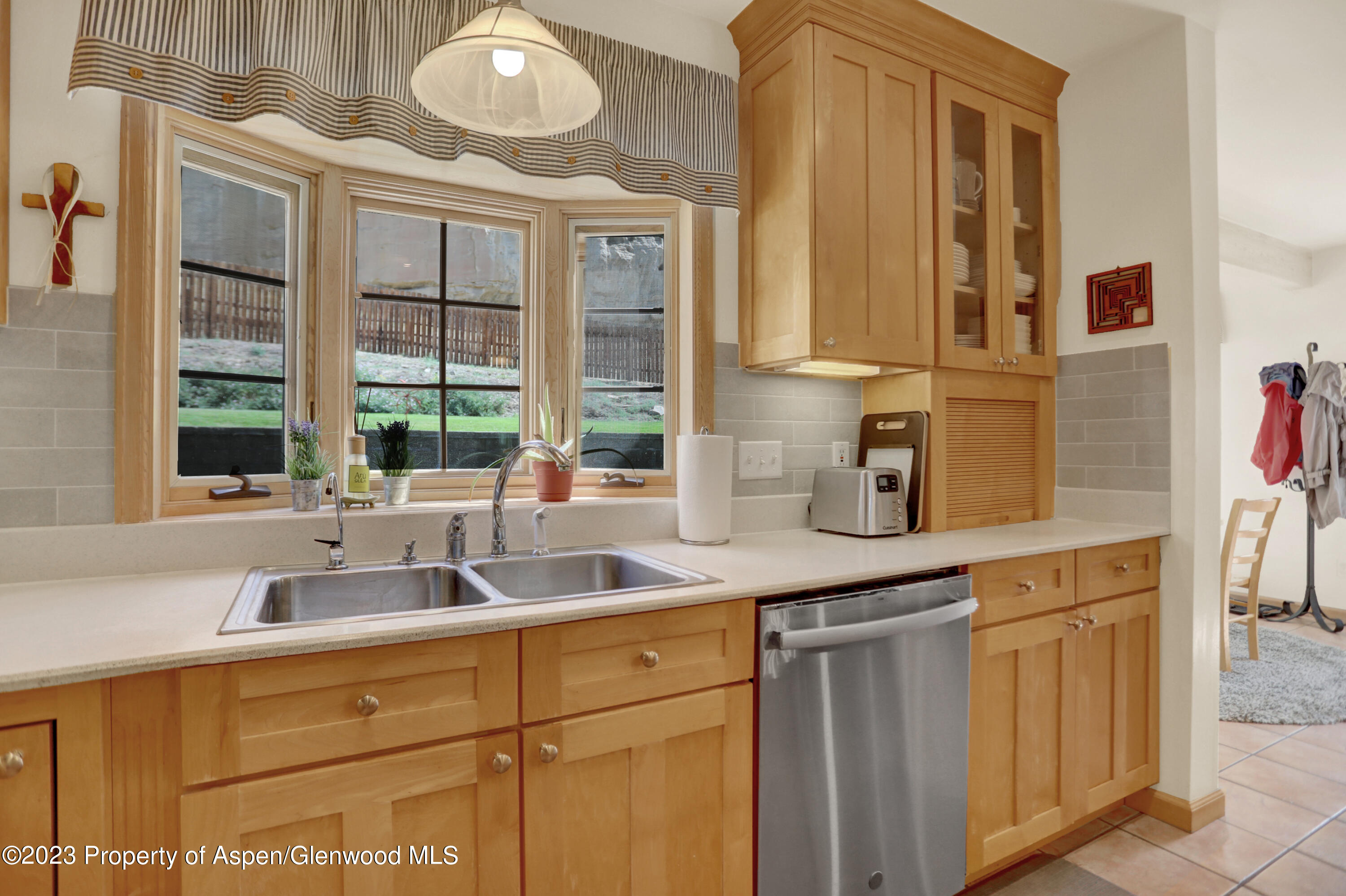 921 Alta Vista Drive Craig, CO 81625 - Photo 13 of 55 a kitchen with cabinets and window