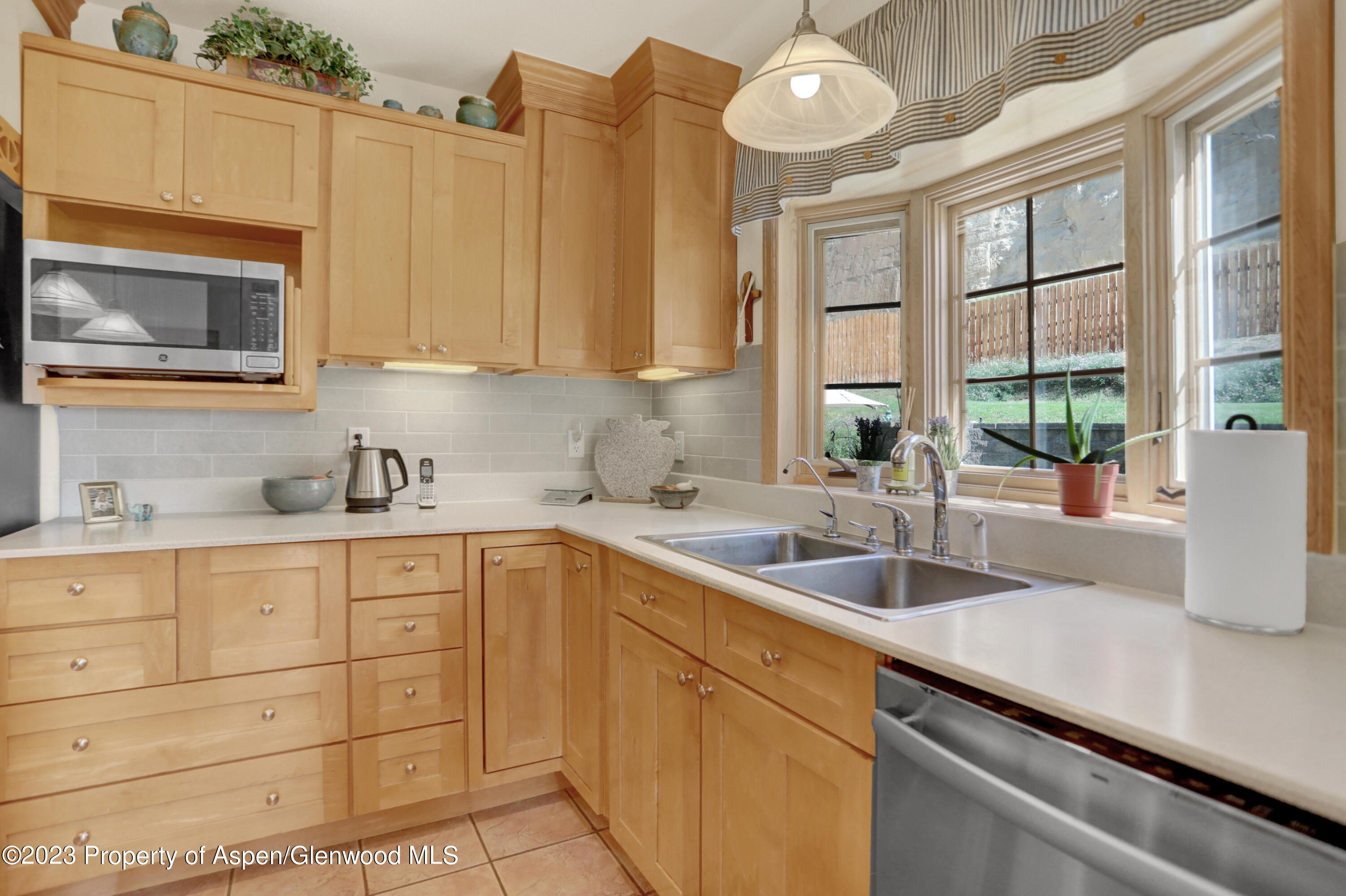 921 Alta Vista Drive Craig, CO 81625 - Photo 14 of 55 a kitchen with a sink and cabinets