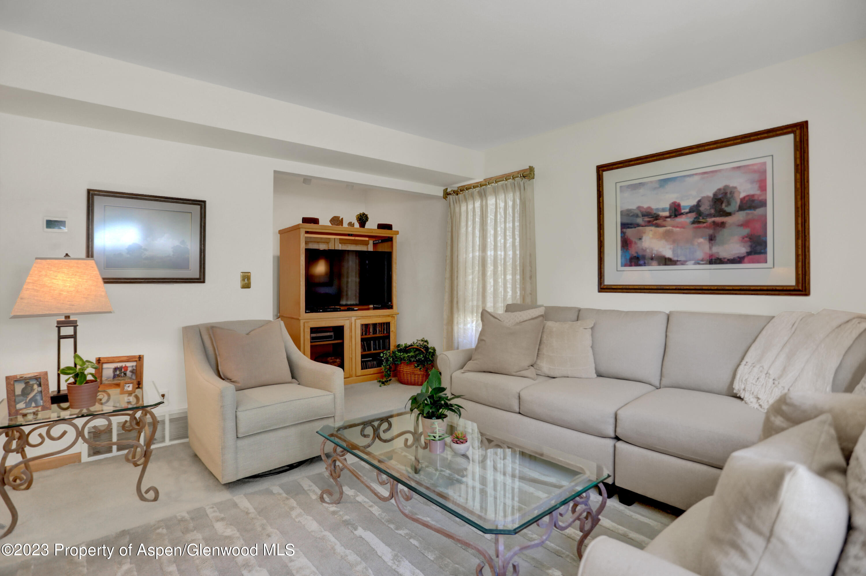 921 Alta Vista Drive Craig, CO 81625 - Photo 19 of 55 a living room with furniture and a flat screen tv