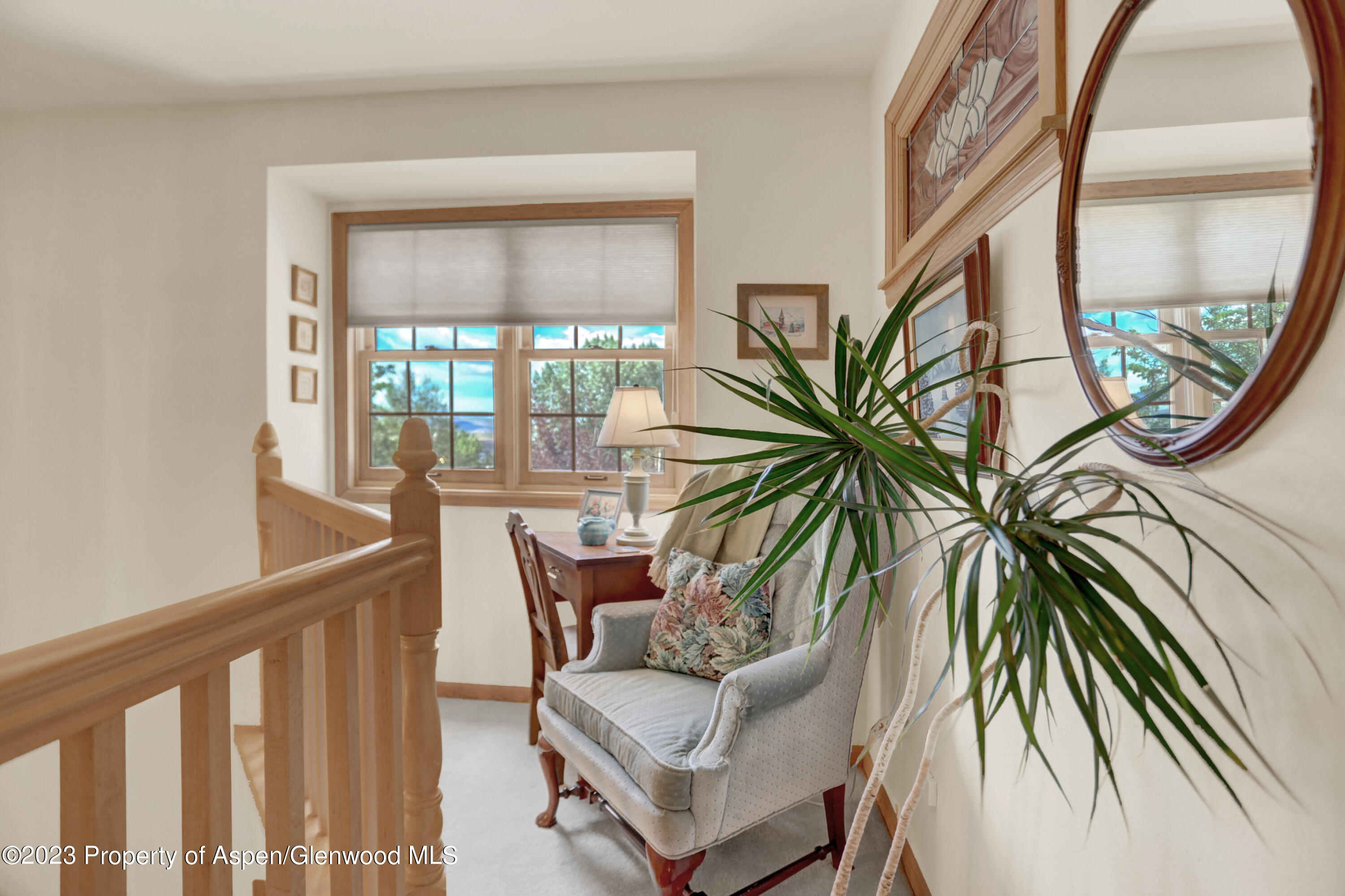 921 Alta Vista Drive Craig, CO 81625 - Photo 22 of 55 a view of a hallway with furniture and floor to ceiling window
