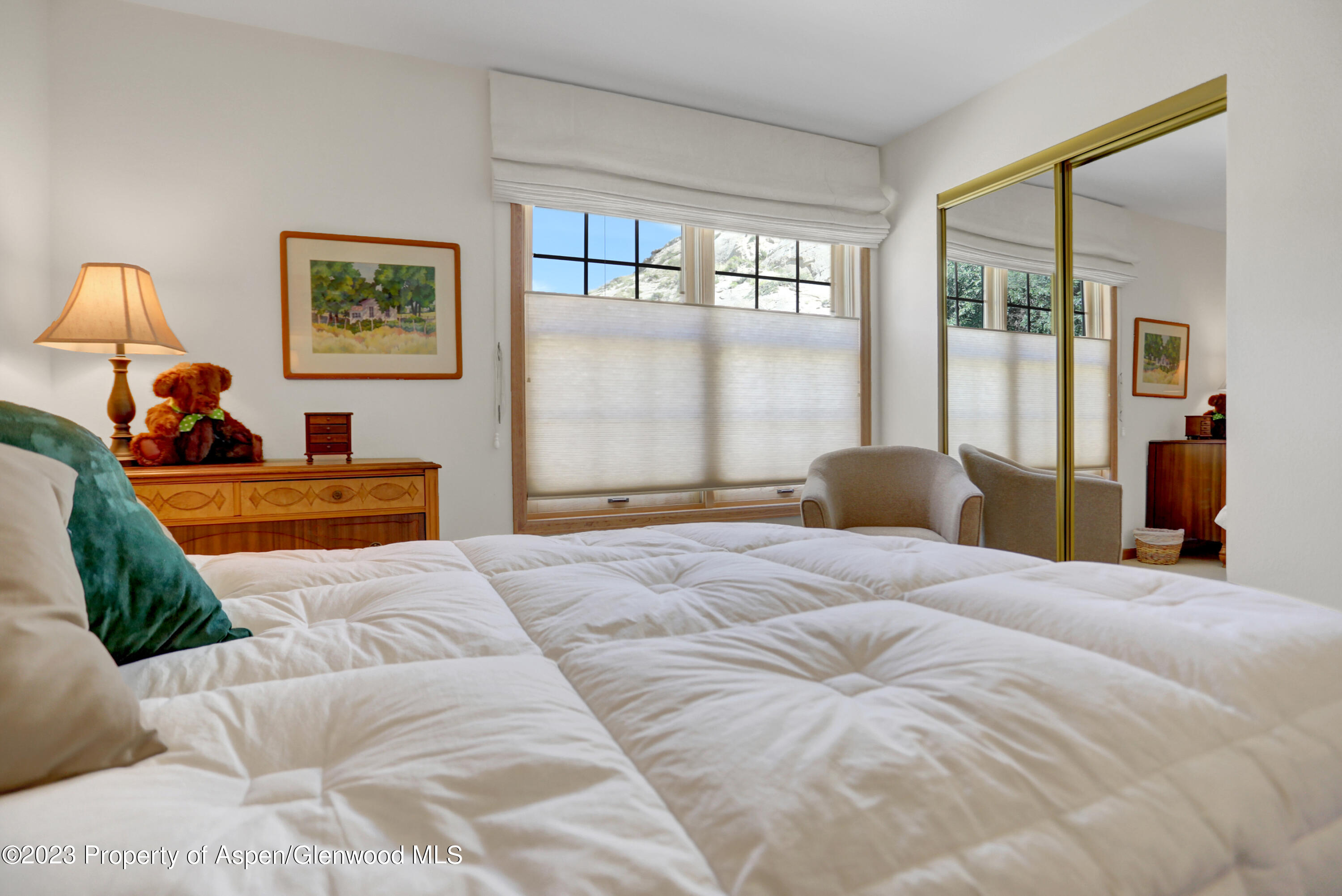 921 Alta Vista Drive Craig, CO 81625 - Photo 24 of 55 a bedroom with a large bed and a window
