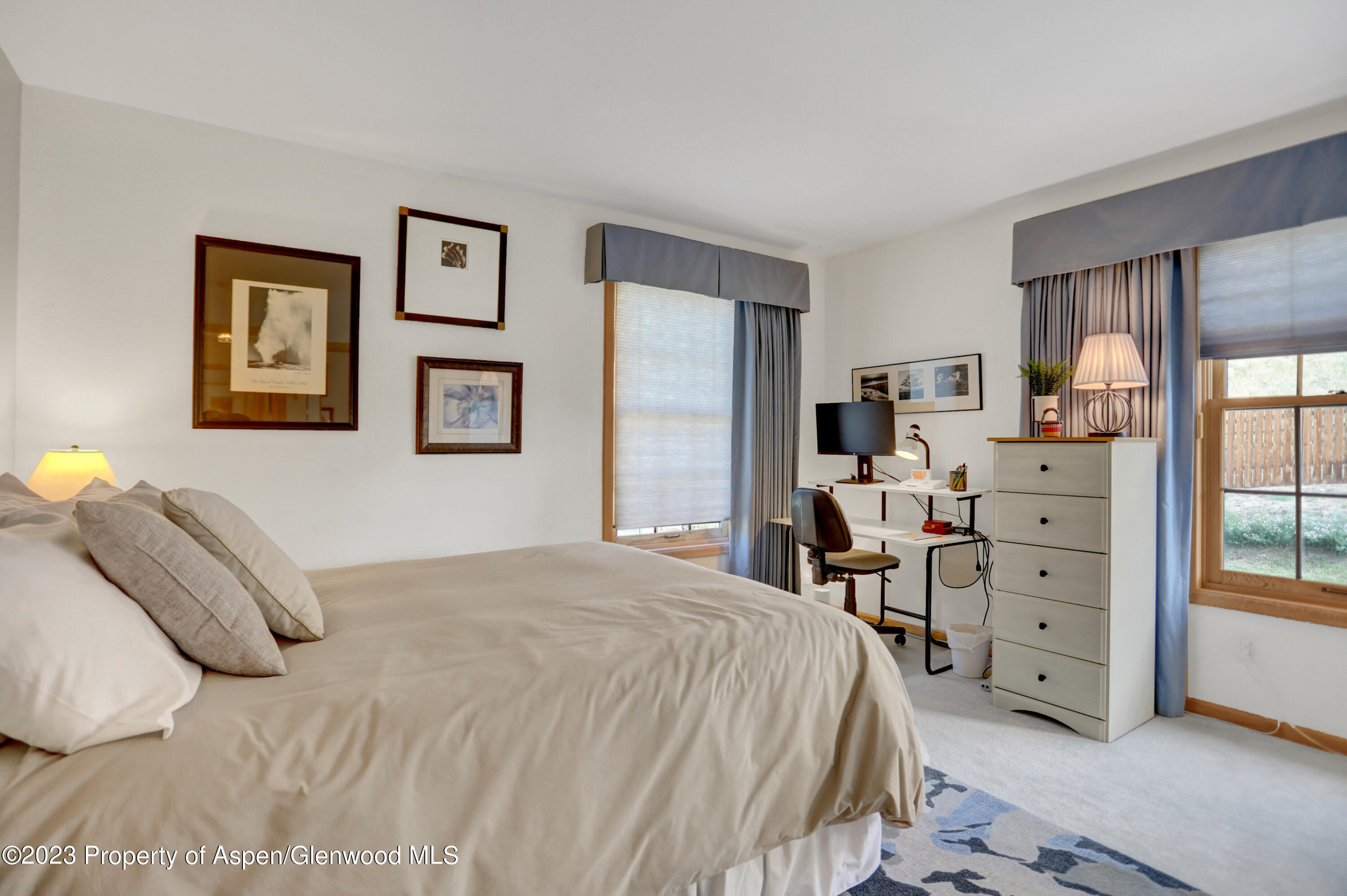 921 Alta Vista Drive Craig, CO 81625 - Photo 27 of 55 a bedroom with a bed and a window