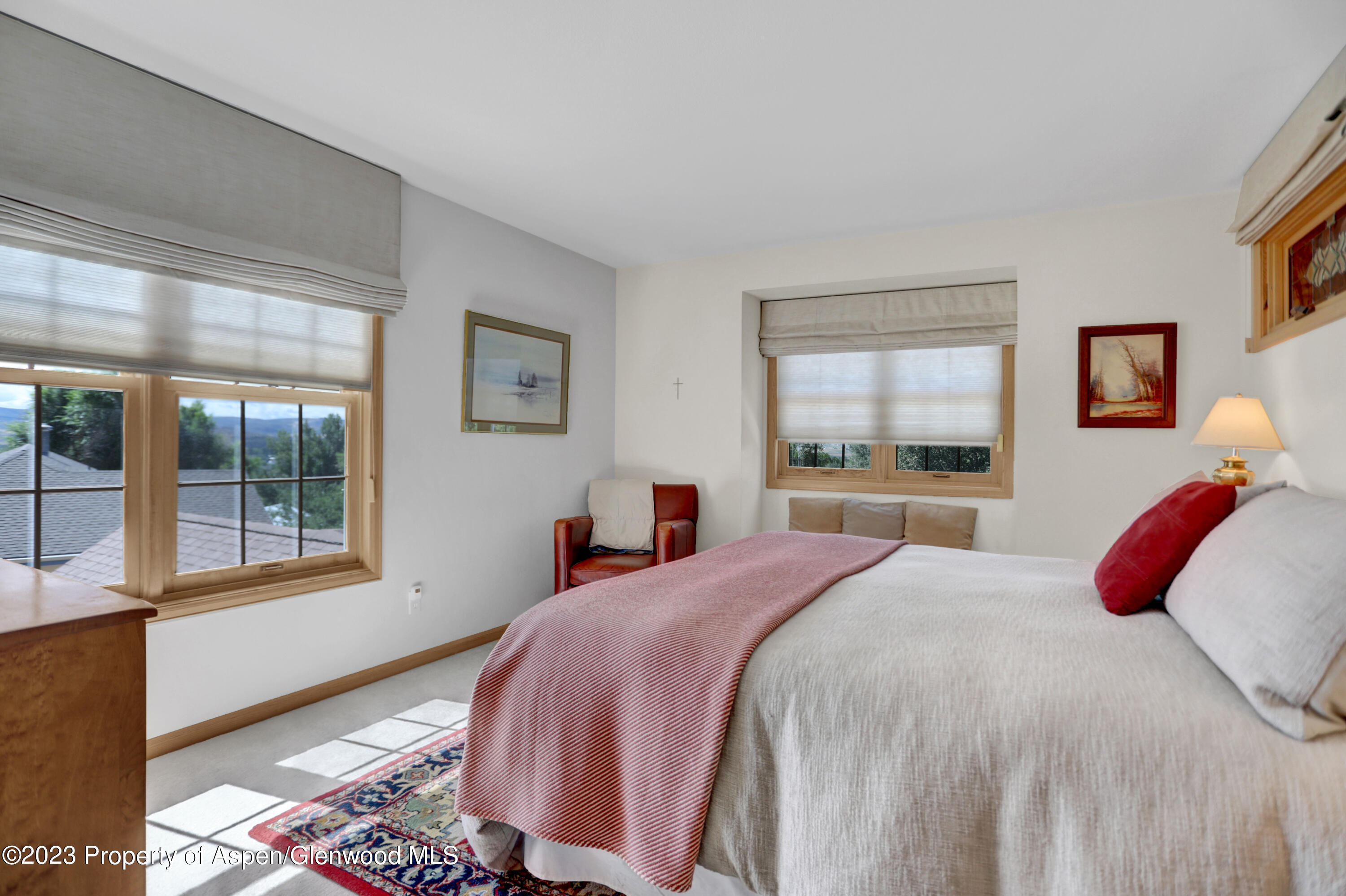 921 Alta Vista Drive Craig, CO 81625 - Photo 33 of 55 a bedroom with a large bed and a window