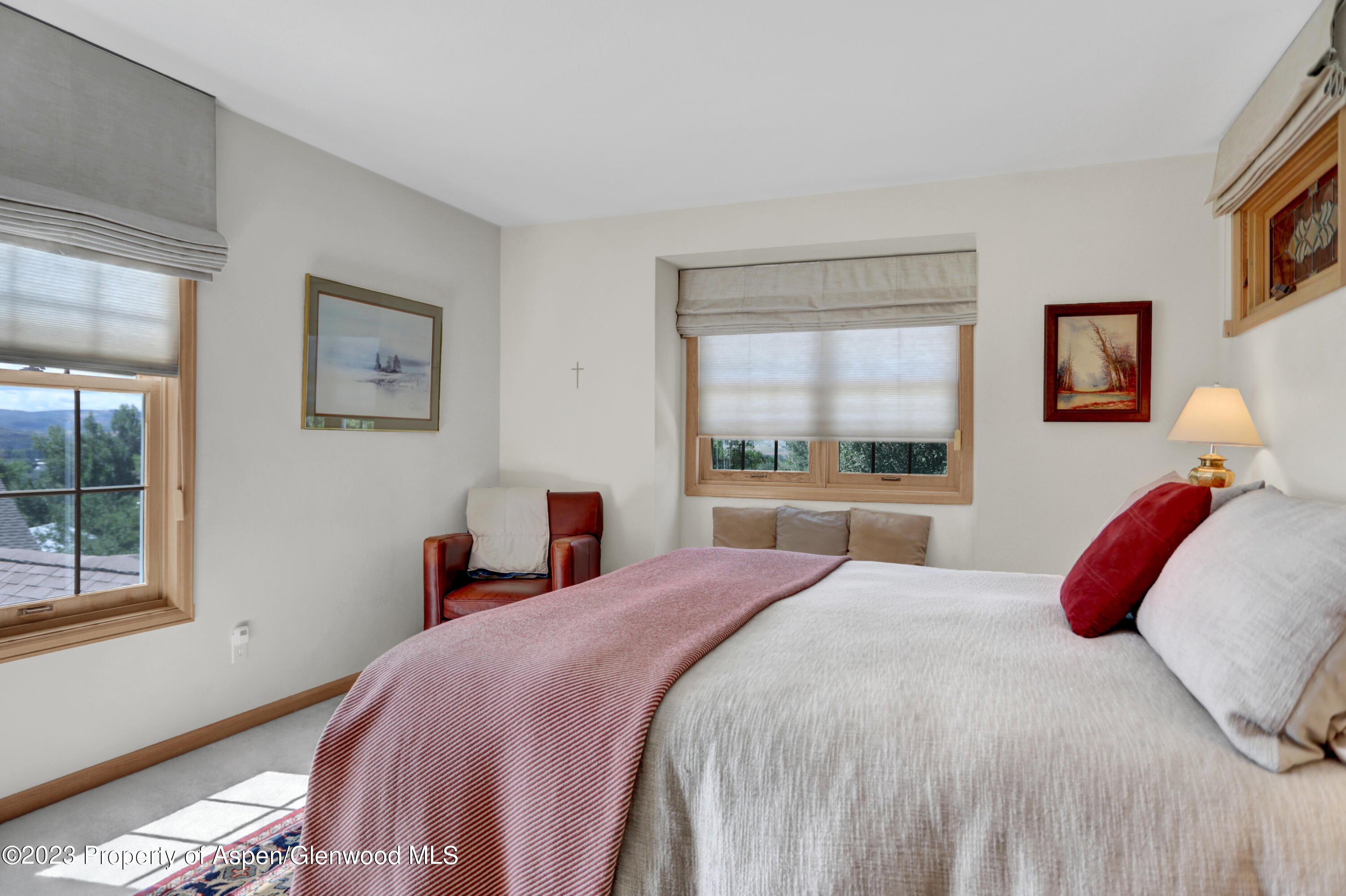 921 Alta Vista Drive Craig, CO 81625 - Photo 34 of 55 a bedroom with a large bed and a window