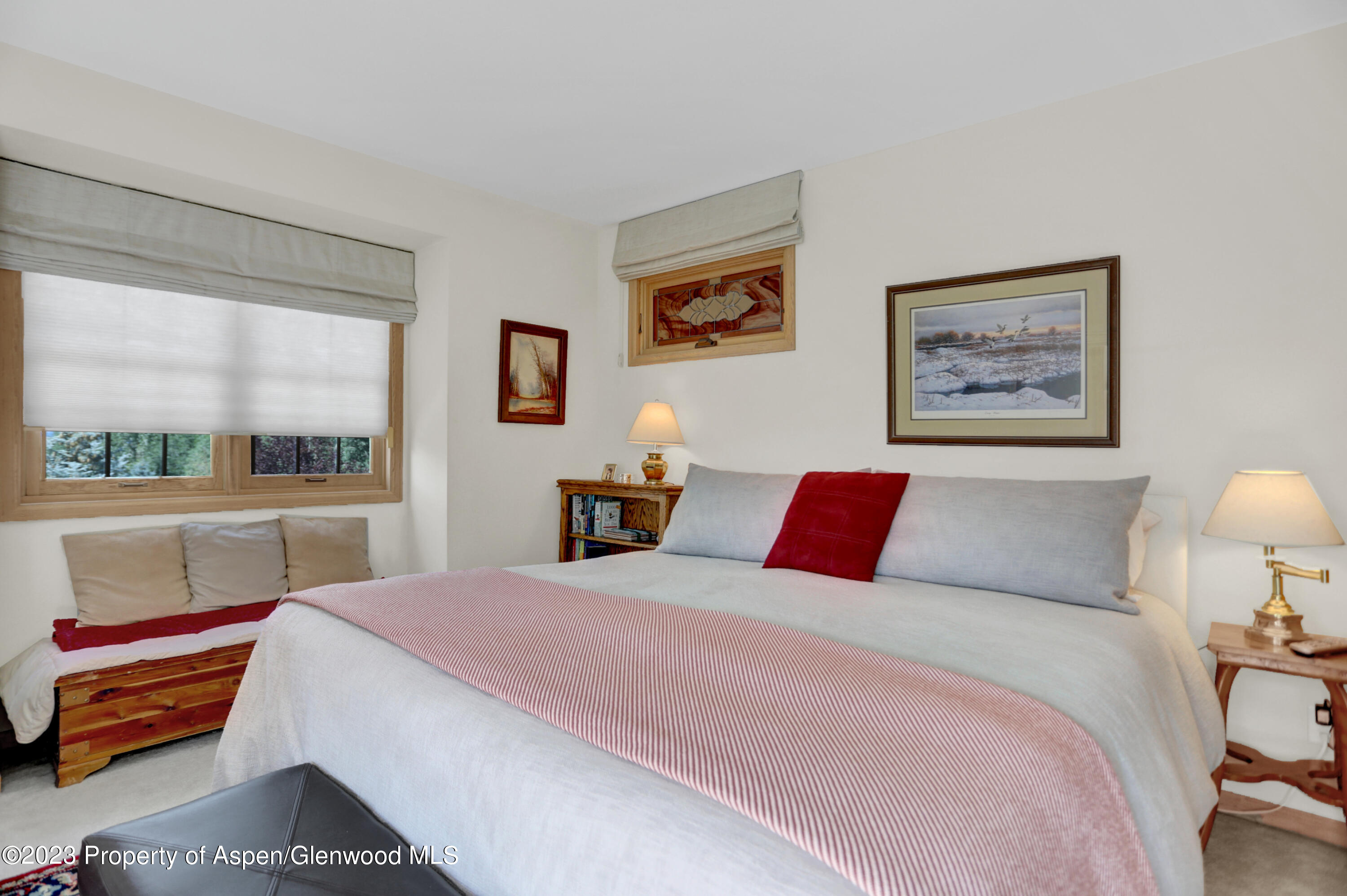 921 Alta Vista Drive Craig, CO 81625 - Photo 35 of 55 a bedroom with a large bed and a window