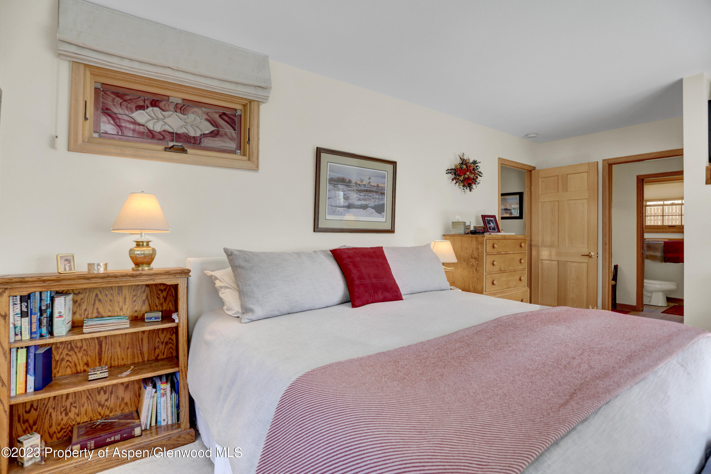 921 Alta Vista Drive Craig, CO 81625 - Photo 36 of 55 a bedroom with a bed and a book shelf