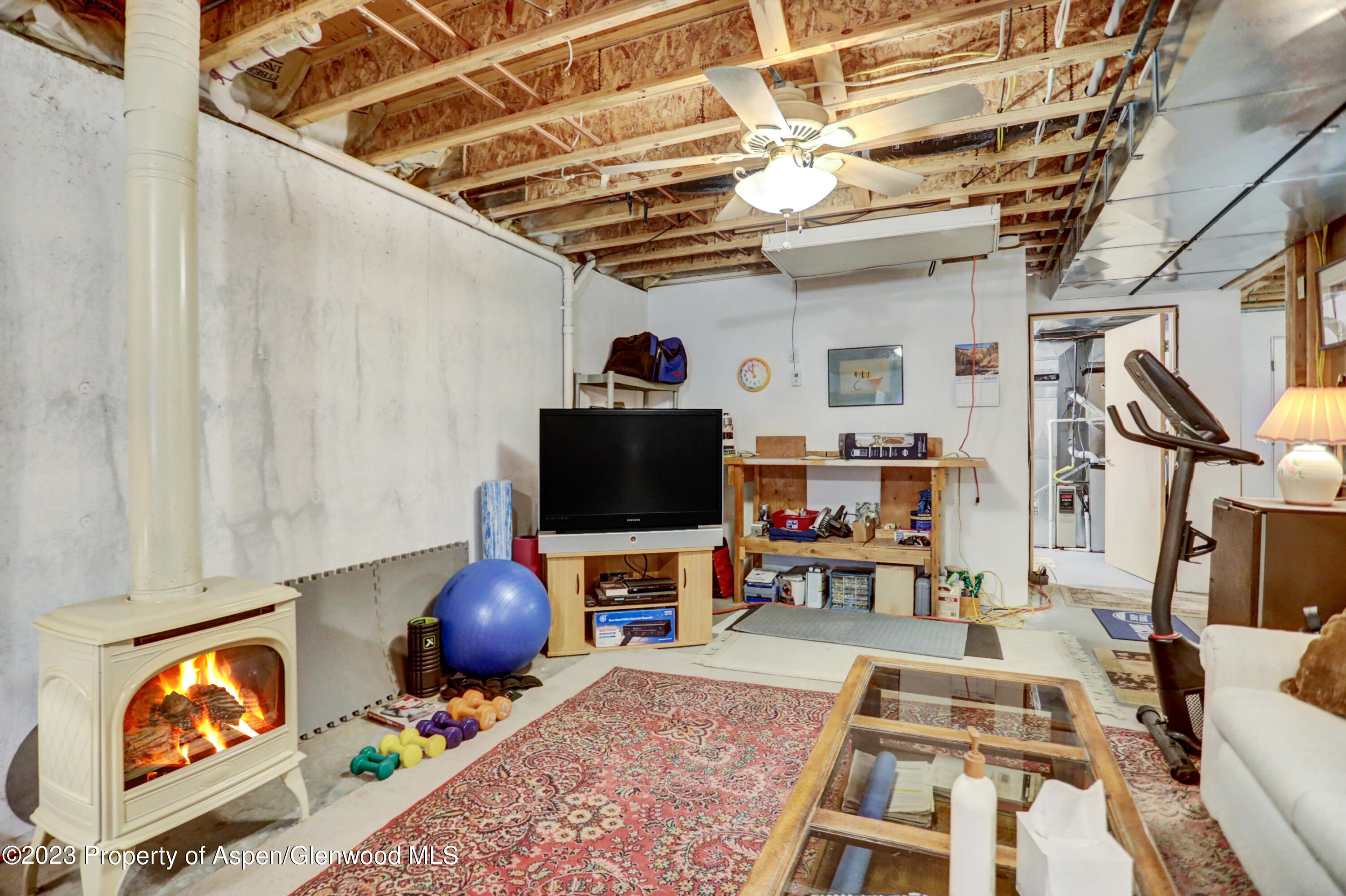 921 Alta Vista Drive Craig, CO 81625 - Photo 49 of 55 a living room with furniture and a flat screen tv