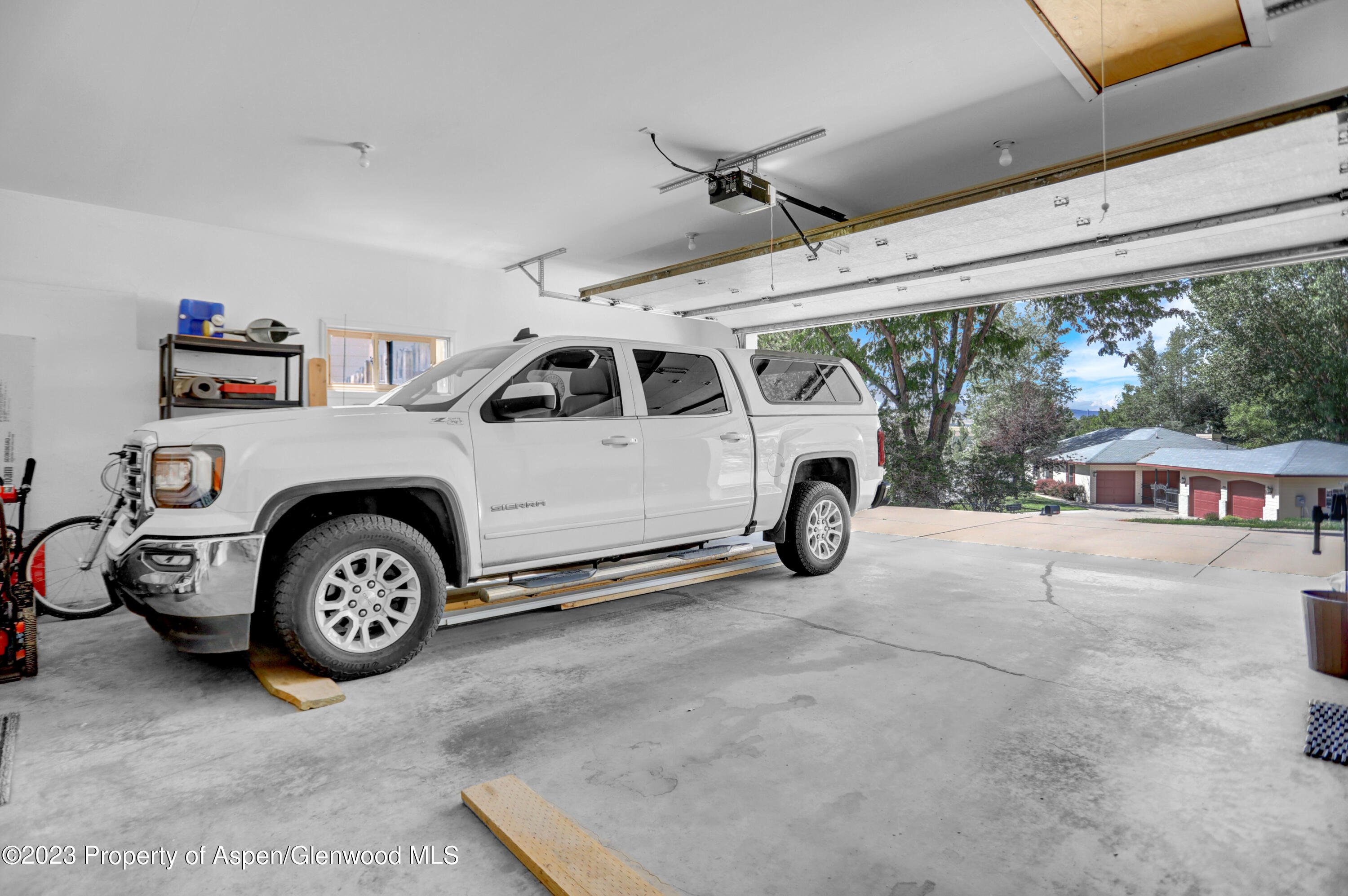 921 Alta Vista Drive Craig, CO 81625 - Photo 51 of 55 a car parked in a garage