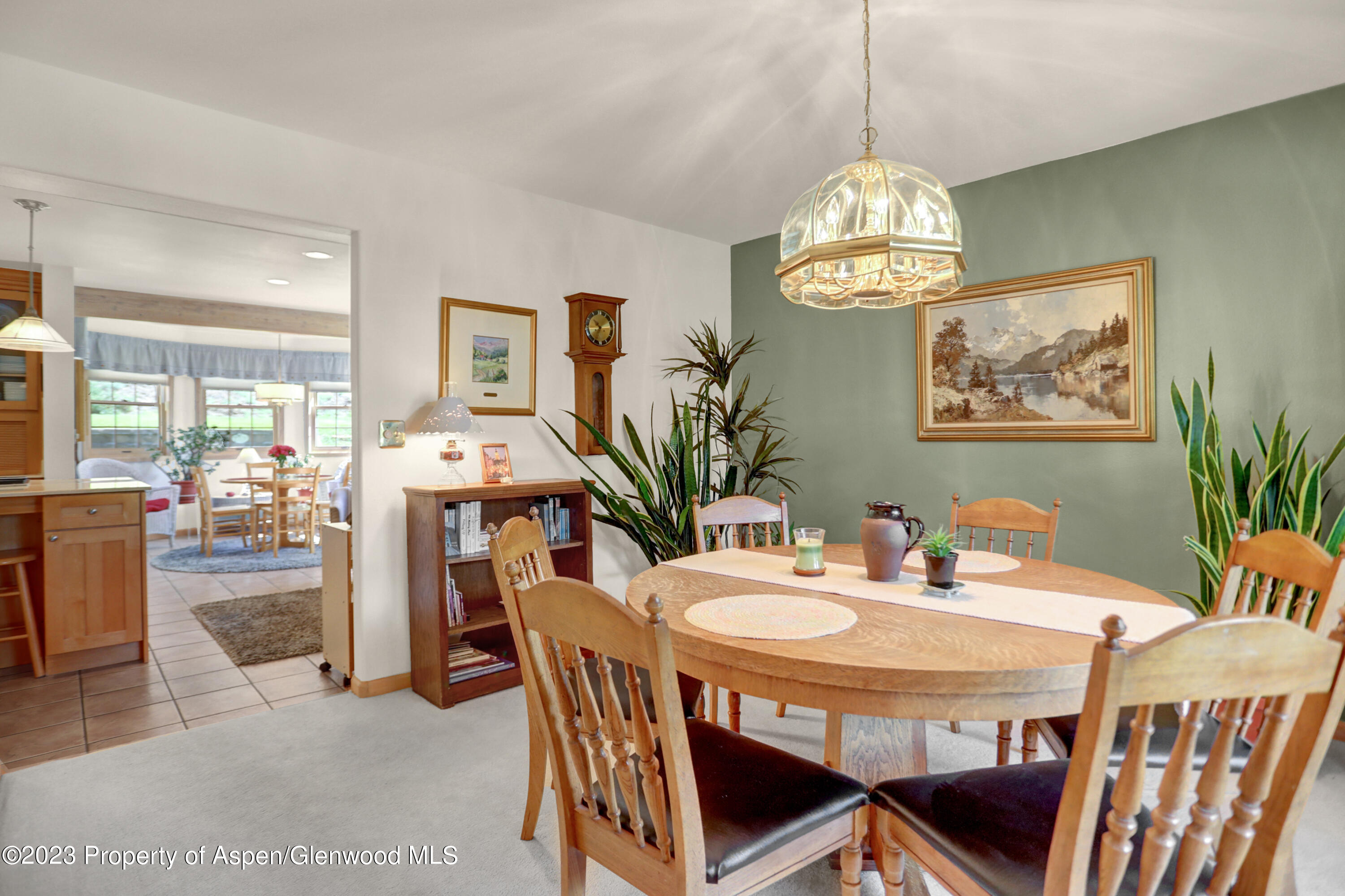 921 Alta Vista Drive Craig, CO 81625 - Photo 9 of 55 a view of a dining room with furniture and chandelier