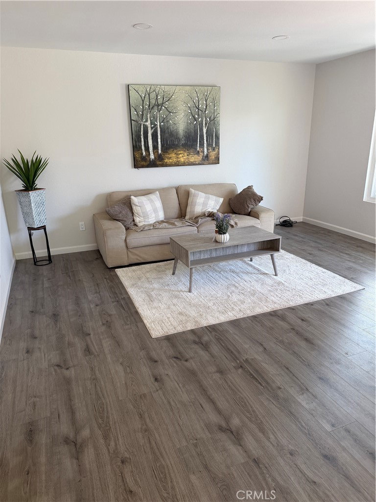 3458 Thunder Drive Oceanside, CA 92056 - Photo 1 of 13 a living room with furniture and wooden floor