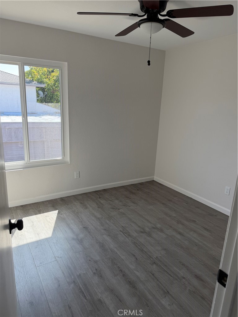 3458 Thunder Drive Oceanside, CA 92056 - Photo 12 of 13 a view of a room with wooden floor and windows