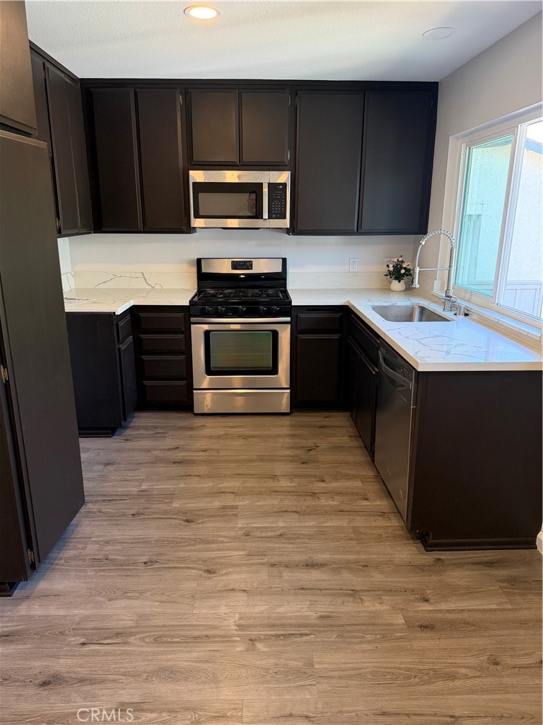 3458 Thunder Drive Oceanside, CA 92056 - Photo 5 of 13 a kitchen with a stove and a sink