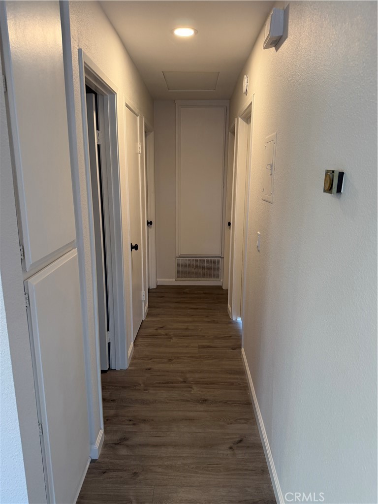 3458 Thunder Drive Oceanside, CA 92056 - Photo 7 of 13 a view of a hallway with wooden floor