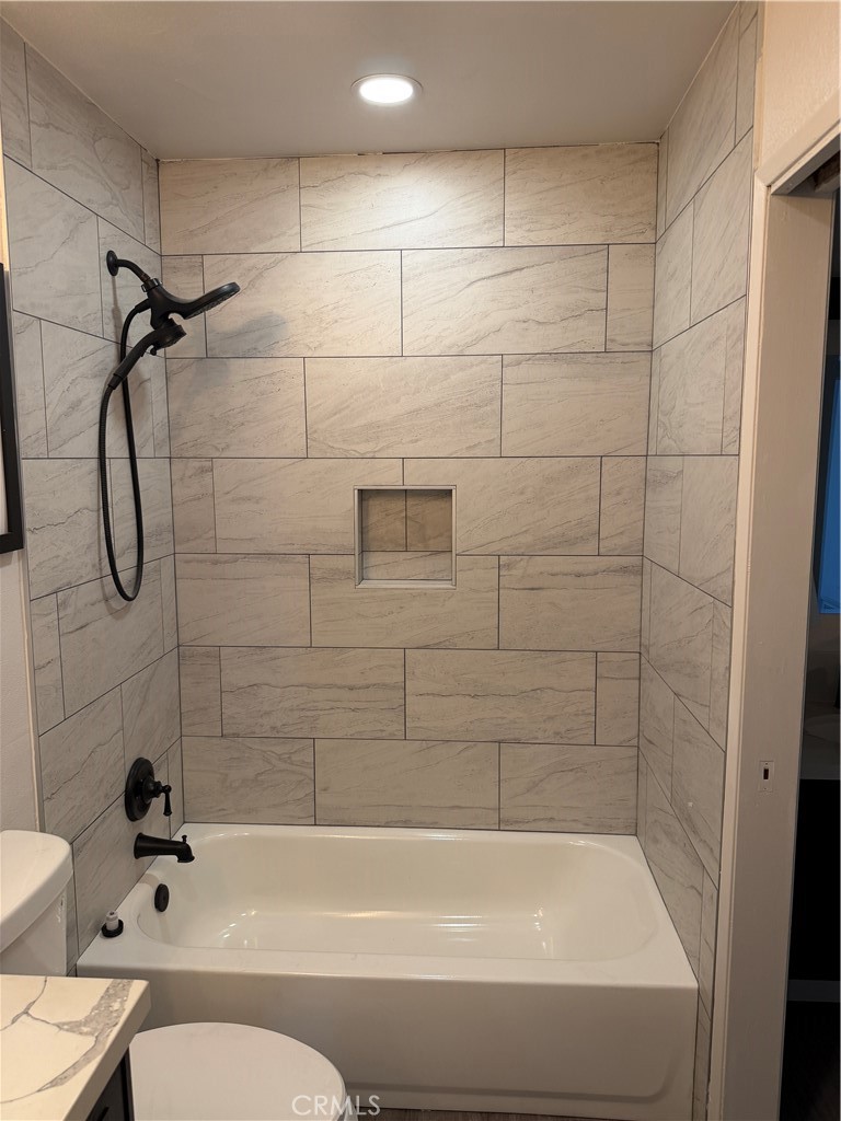 3458 Thunder Drive Oceanside, CA 92056 - Photo 9 of 13 a bathroom with a bathtub and a shower