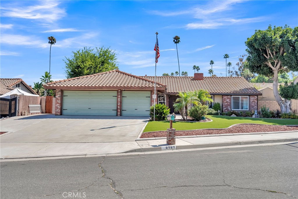 2727 Lexington Place Riverside, CA 92506 - Photo 1 of 1 a front view of a house with a yard and potted plants