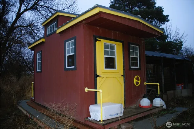 a backyard of a house with plants and trees
