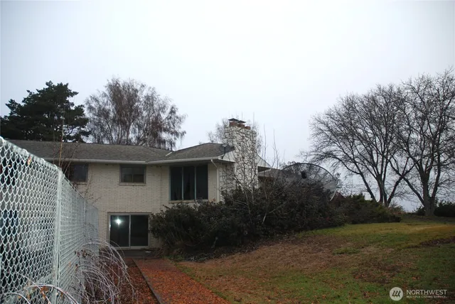 a bedroom with a bed and a table in it