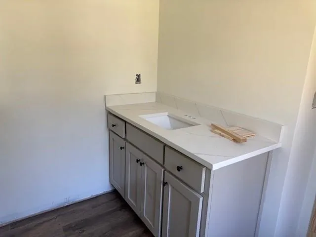 a bathroom with a sink and a mirror